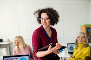 A woman with a tablet representing the importance of upskilling