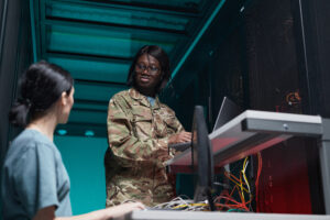 A service member and a tech professional managing servers in a data center, representing DoD SkillBridge opportunities in IT and technology careers.